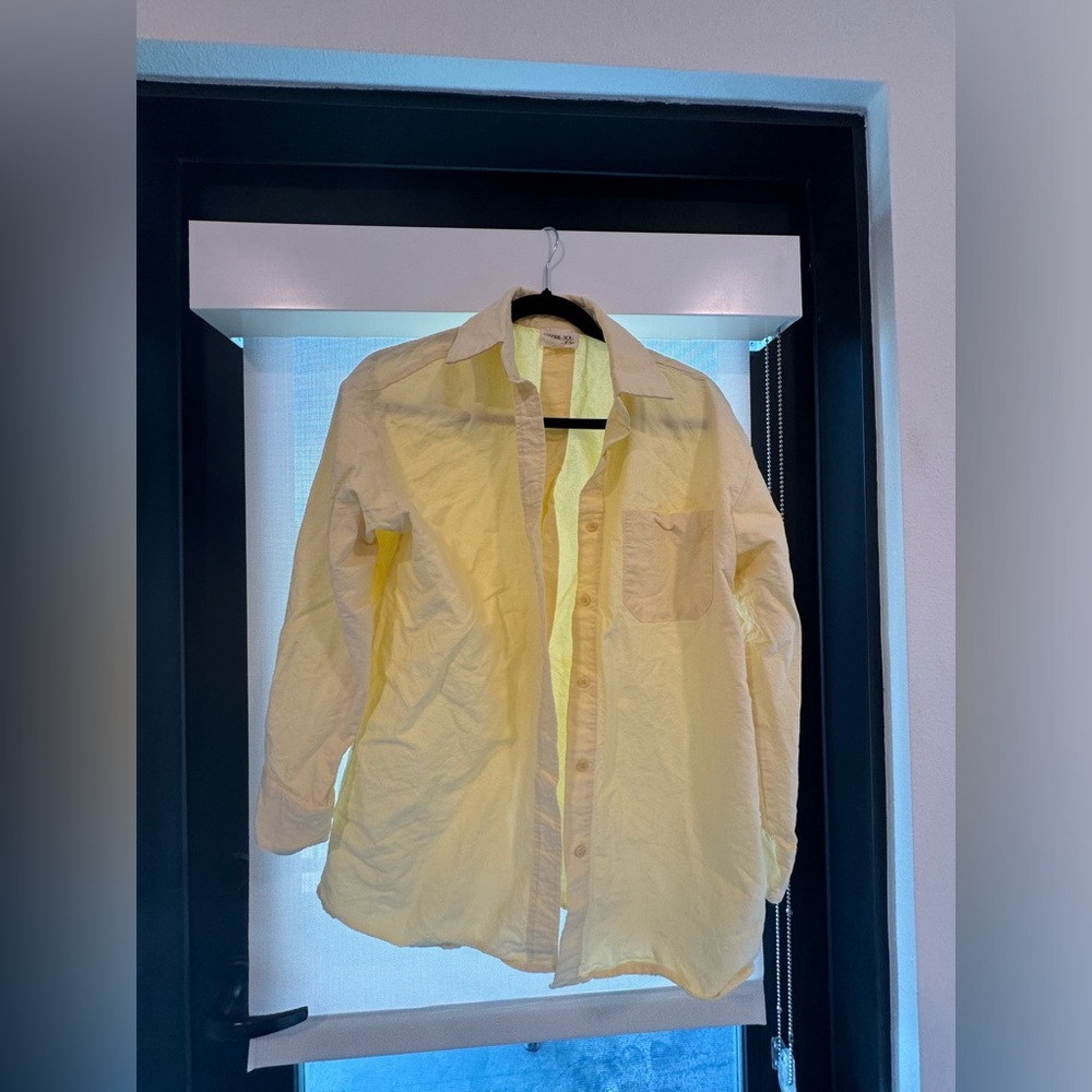 Yellow button down shirt
